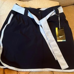 Nike golf skirt with two layers underneath are shorts dark blue has front pocket